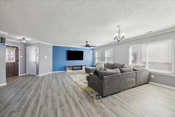 a living room with furniture and a flat screen tv