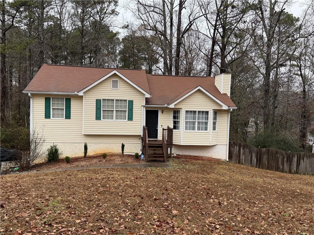 607 Senator Road Douglasville, GA 30134 - Photo 1 of 16 a house with trees in the background