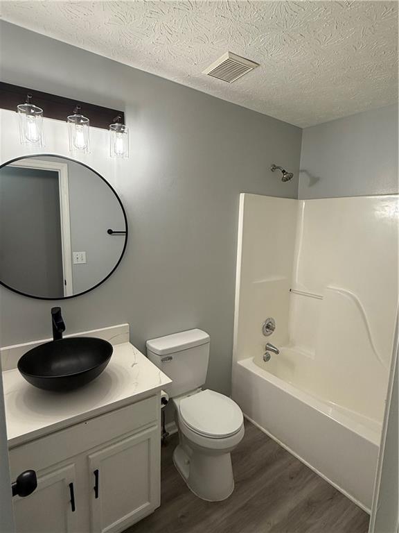 607 Senator Road Douglasville, GA 30134 - Photo 12 of 16 a bathroom with a toilet a sink and bathtub
