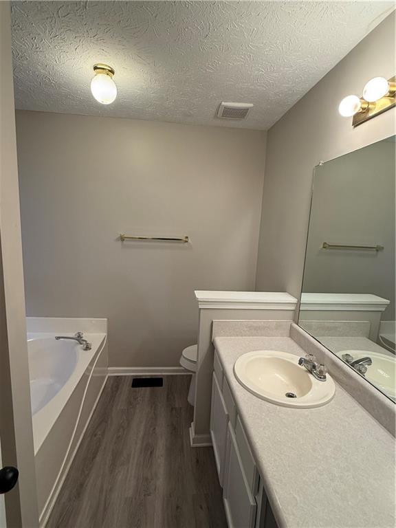 607 Senator Road Douglasville, GA 30134 - Photo 8 of 16 a bathroom with a sink and a bathtub