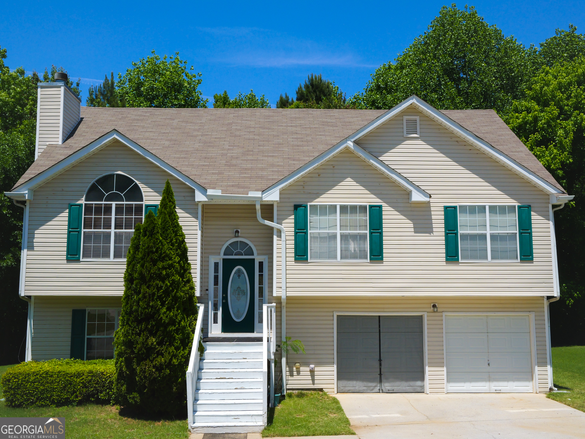 a front view of a house with a yard