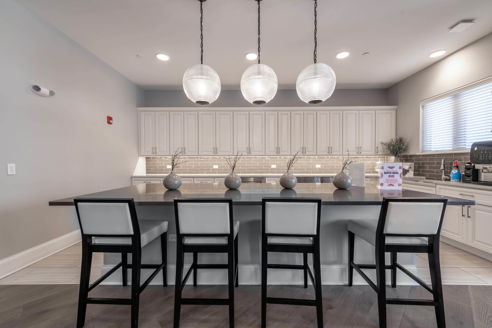 21599 West Field Court, Unit 1213 Deer Park, IL 60010 - Photo 9 of 14 a kitchen with lots of counter space and dining table