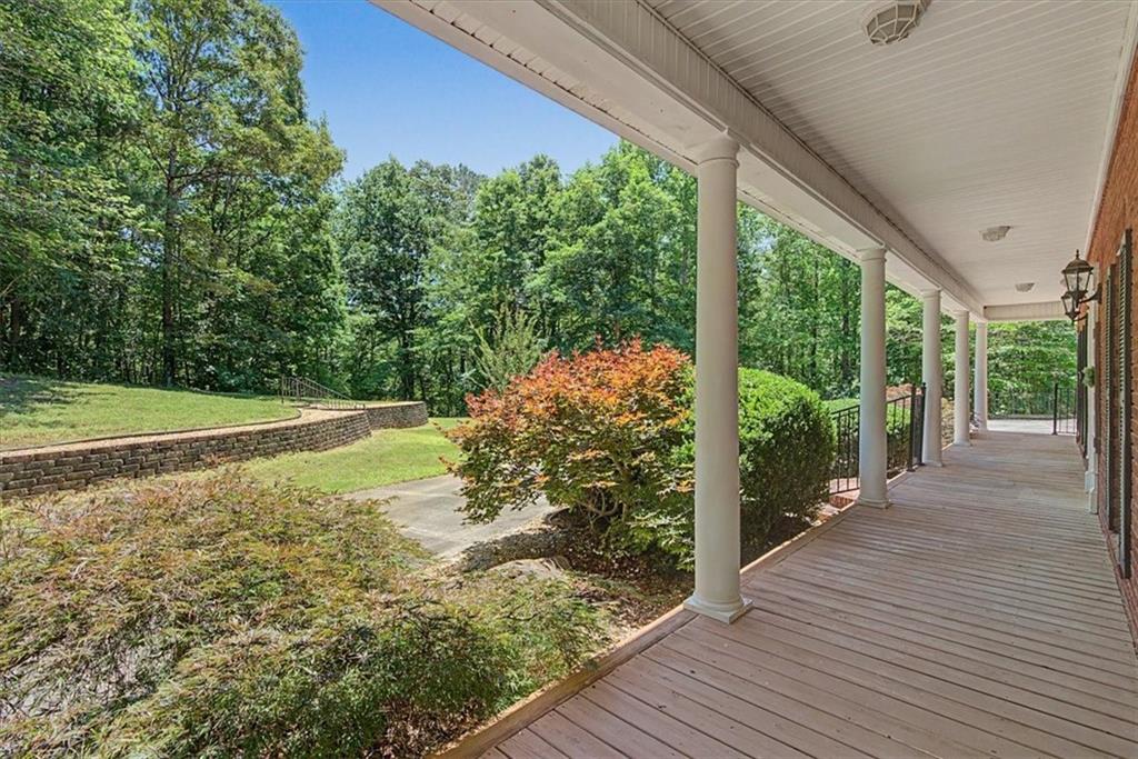 1136 Cole Lake Road Dallas, GA 30157 - Photo 10 of 72 a view of a balcony with floor to ceiling windows with wooden floor