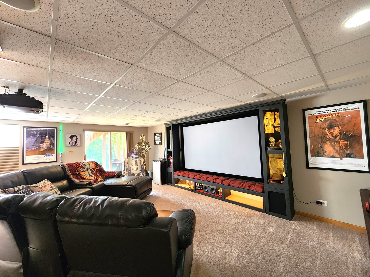257 Grand Ridge Road, Unit 257 St. Charles, IL 60175 - Photo 48 of 65 a living room with furniture a projector and screen
