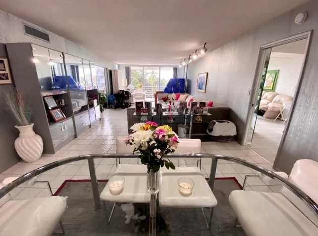 a dining room with furniture and wooden floor