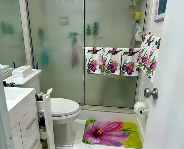 a bathroom with a toilet and a sink