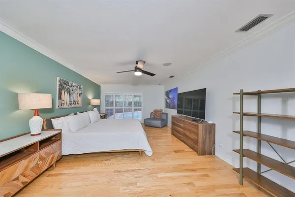 a spacious bedroom with a bed and a couch