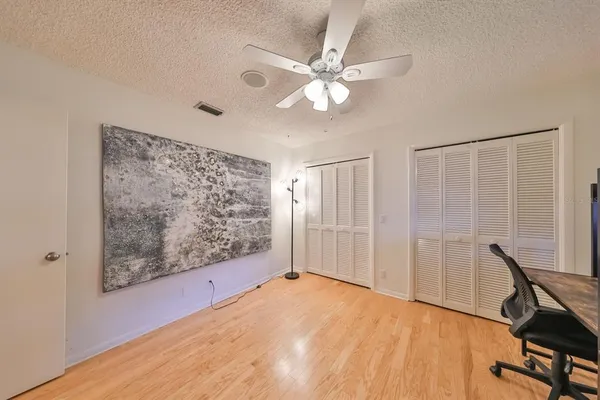 a kitchen with stainless steel appliances granite countertop a sink dishwasher stove top oven and wooden cabinets