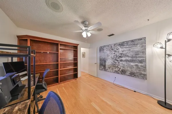 a kitchen with stainless steel appliances kitchen island granite countertop a sink and cabinets