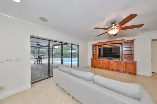 a living room with furniture and kitchen view