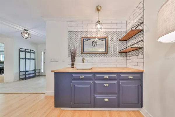 a bedroom with furniture and a flat screen tv