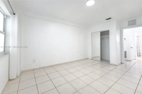 a view of an empty room and window