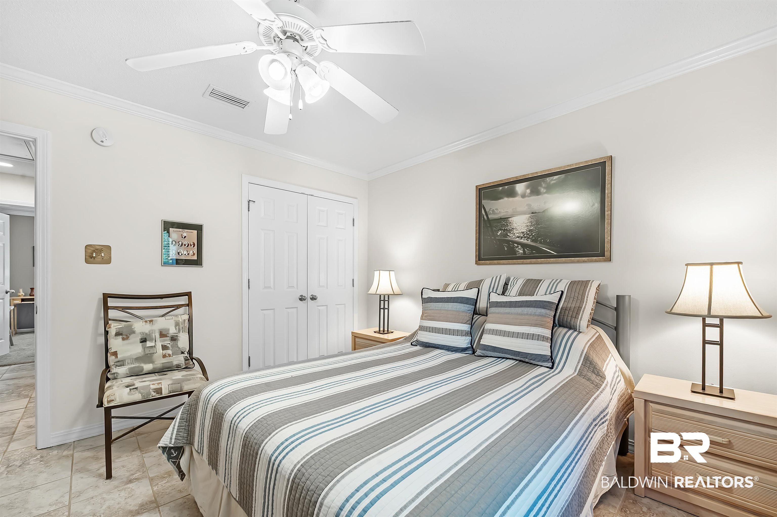 9908 Clarke Ridge Road Foley, AL 36535 - Photo 46 of 56 Bedroom featuring a closet, a ceiling fan, baseboards, visible vents, and ornamental molding