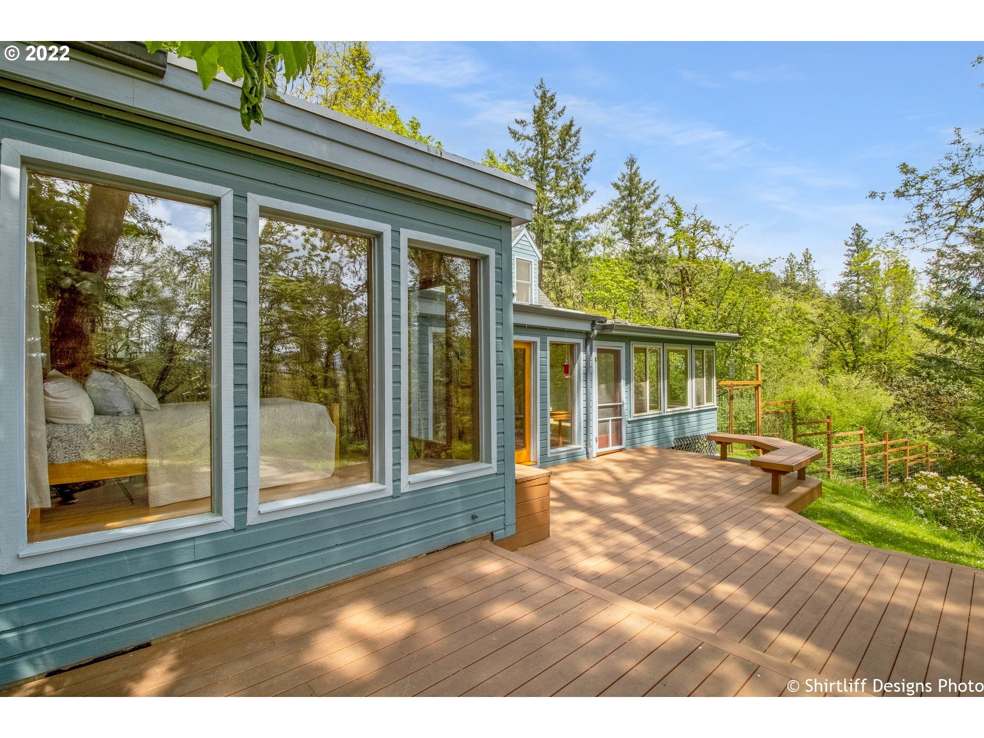 31872 Fox Hollow Road Eugene, OR 97405 - Photo 1 of 32 a view of a porch with a floor to ceiling window and tree