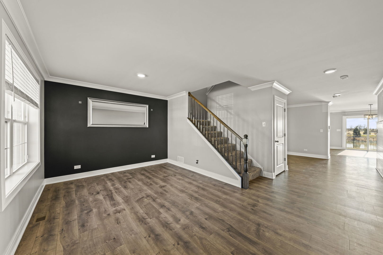 934 Redcliff Road New Lenox, IL 60451 - Photo 4 of 34 a view of an empty room with wooden floor and a window