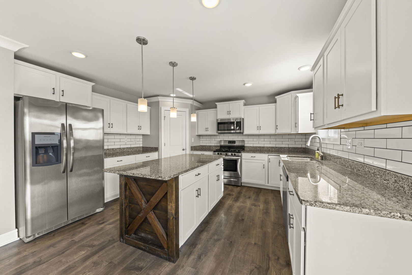 934 Redcliff Road New Lenox, IL 60451 - Photo 6 of 34 a kitchen with white cabinets and stainless steel appliances