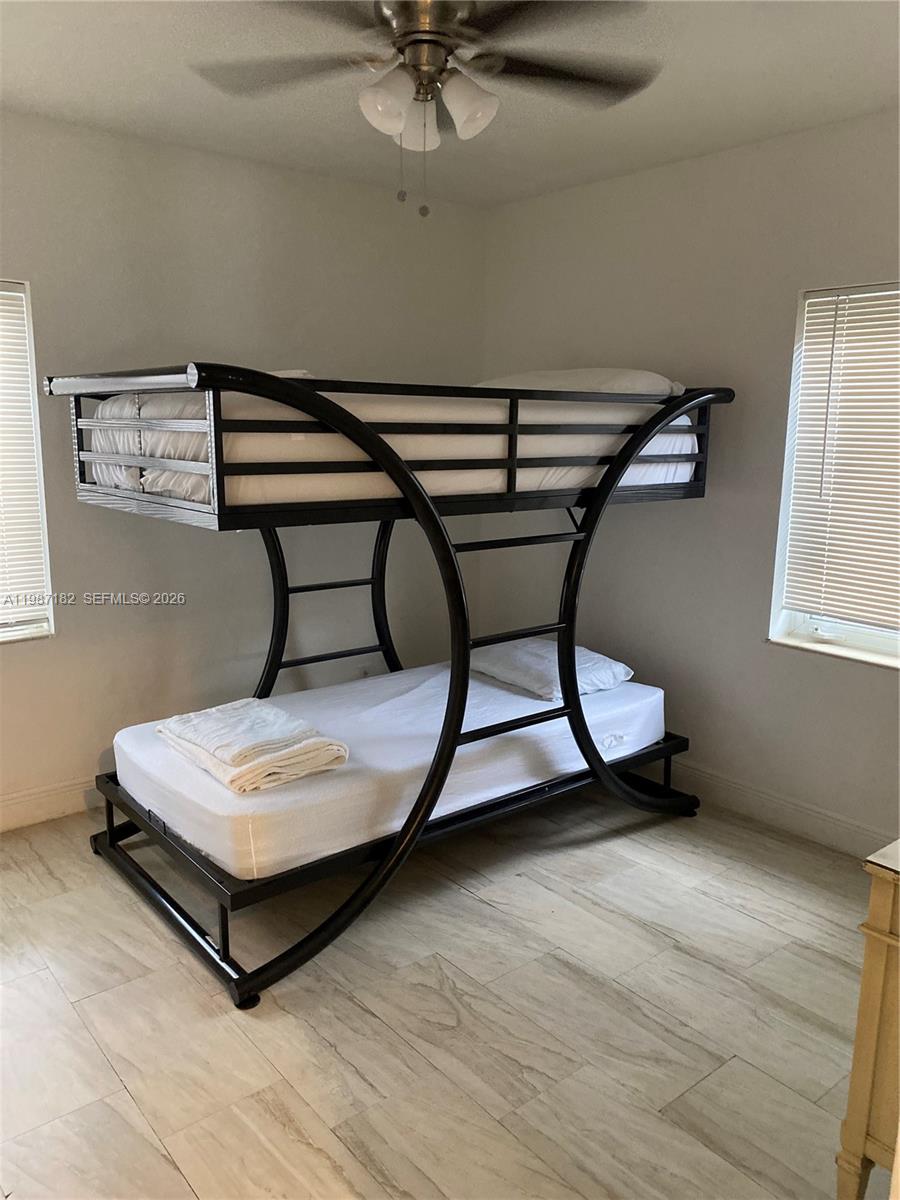 2 Northeast 45th Street Miami, FL 33137 - Photo 14 of 27 a room with a table chairs and wooden floor