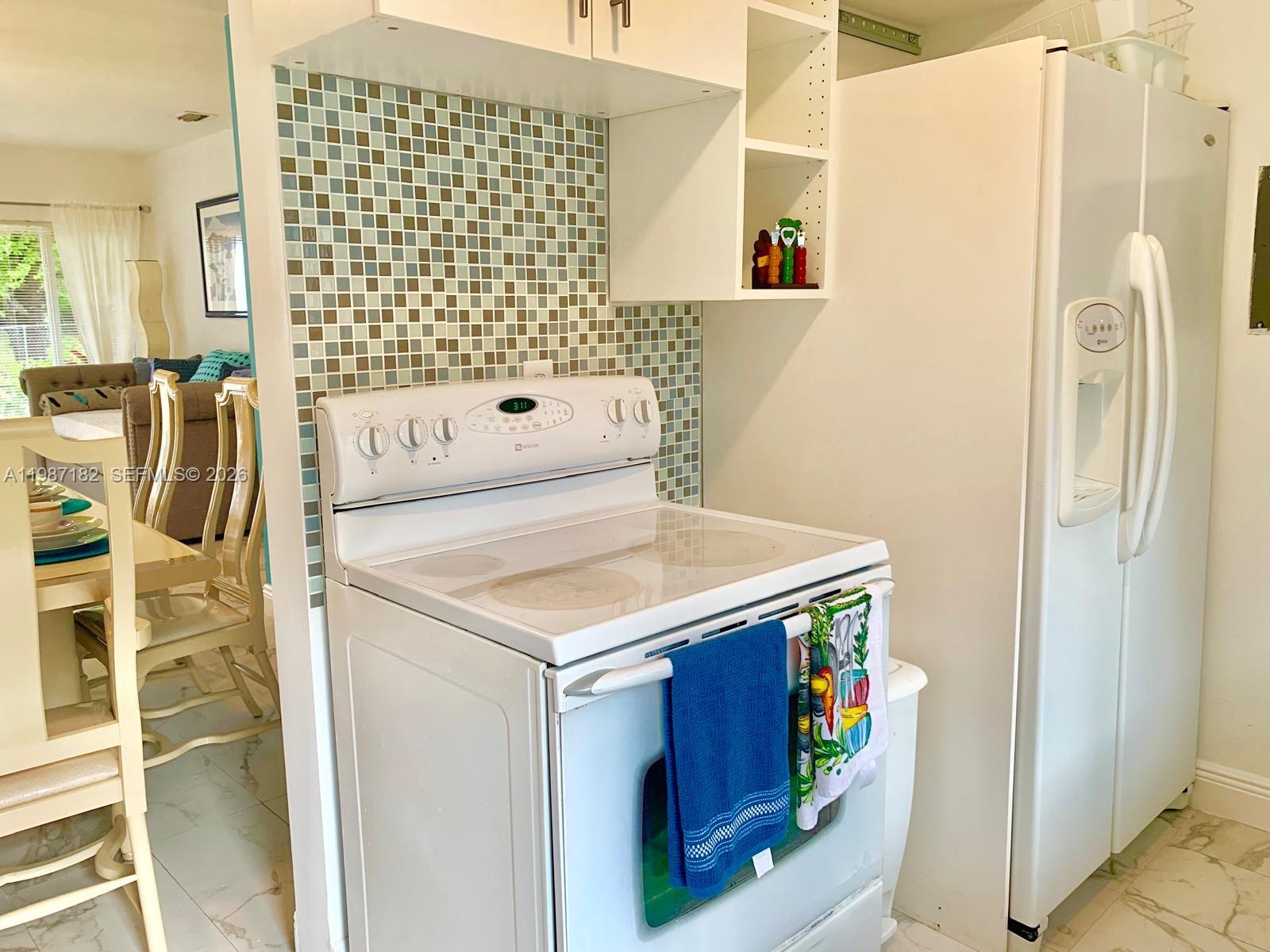 2 Northeast 45th Street Miami, FL 33137 - Photo 19 of 27 a utility room with dryer and washer