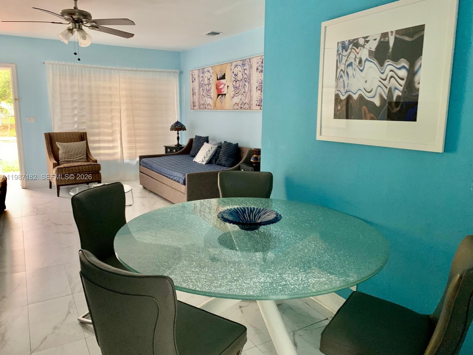 2 Northeast 45th Street Miami, FL 33137 - Photo 20 of 27 a living room with furniture and a window
