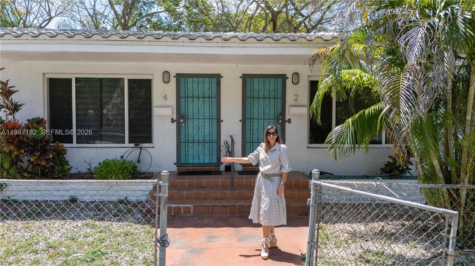 2 Northeast 45th Street Miami, FL 33137 - Photo 2 of 27 a front view of a house with garden