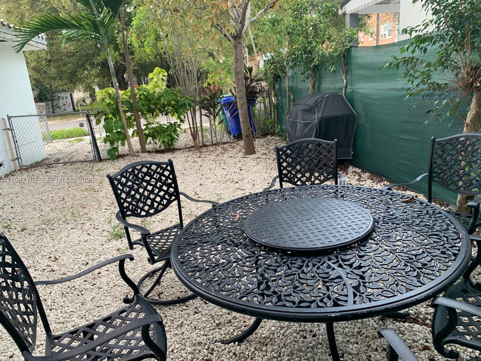 2 Northeast 45th Street Miami, FL 33137 - Photo 22 of 27 a view of a chairs and table in patio
