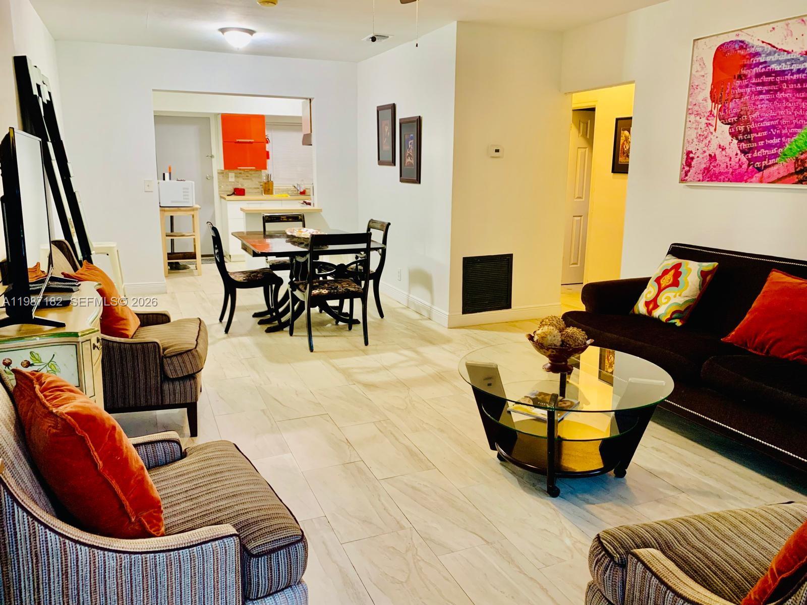 2 Northeast 45th Street Miami, FL 33137 - Photo 10 of 27 a living room with furniture and wooden floor