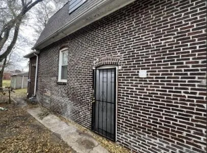 a brick building with a street