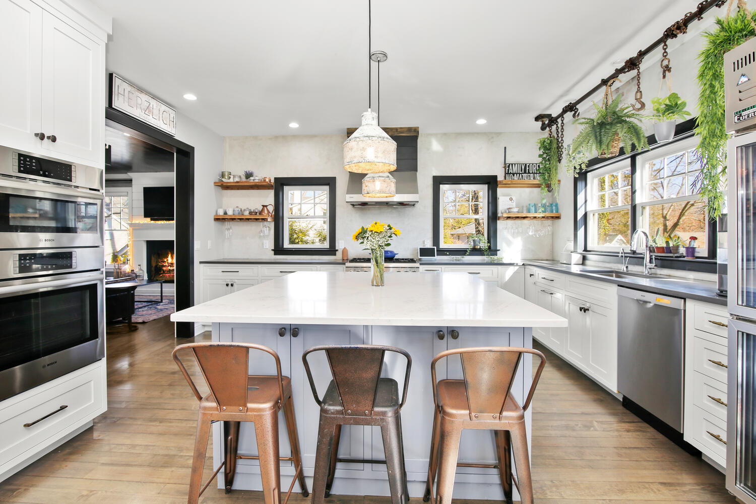 12 Pond Ridge Lane Rowayton, CT 06853 - Photo 14 of 35 a kitchen with stainless steel appliances a dining table chairs sink and cabinets