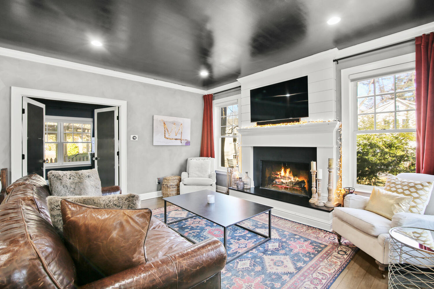 12 Pond Ridge Lane Rowayton, CT 06853 - Photo 8 of 35 a living room with furniture a flat screen tv and a fireplace