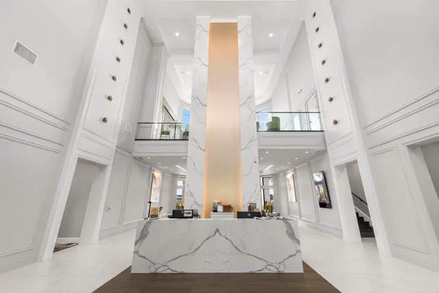 an aerial view of residential houses with outdoor space and swimming pool