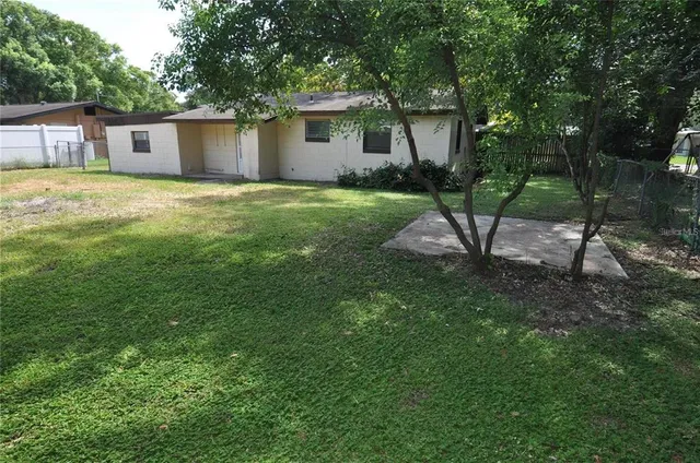 a view of backyard with green space
