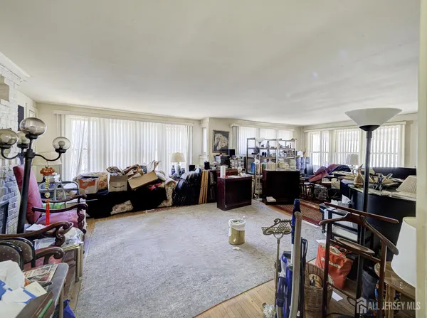 a living room with lots of furniture and a window