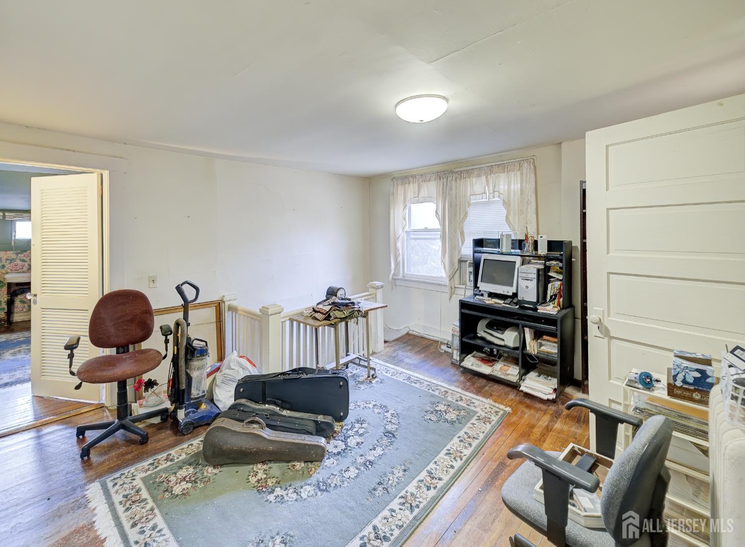 519 Terrill Road Fanwood, NJ 07023 - Photo 15 of 23 a living room with furniture and wooden floor