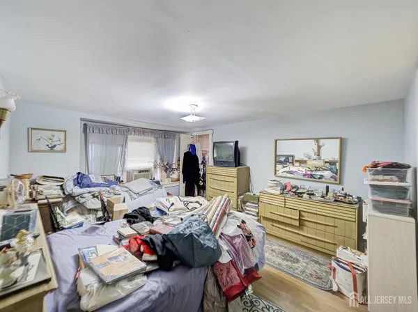 a bed room with furniture and wooden floor