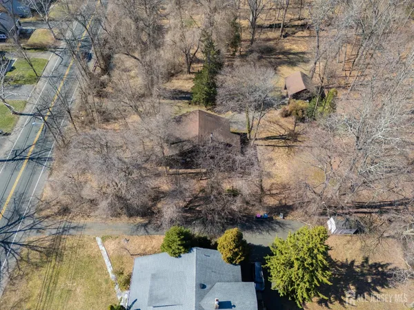 a aerial view of a house with a yard