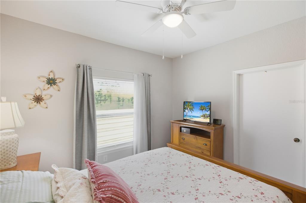 5122 Northridge Road, Unit 107 Sarasota, FL 34238 - Photo 21 of 36 a bedroom with a bed and a window