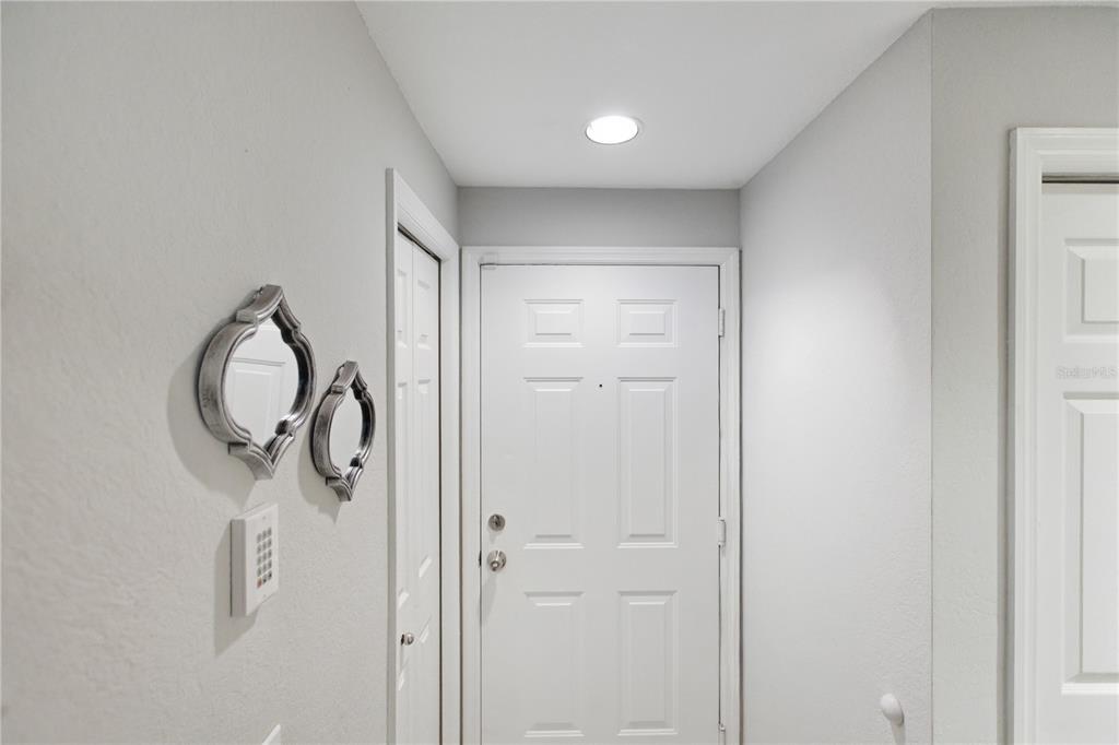 5122 Northridge Road, Unit 107 Sarasota, FL 34238 - Photo 22 of 36 a bathroom with a shower and mirror