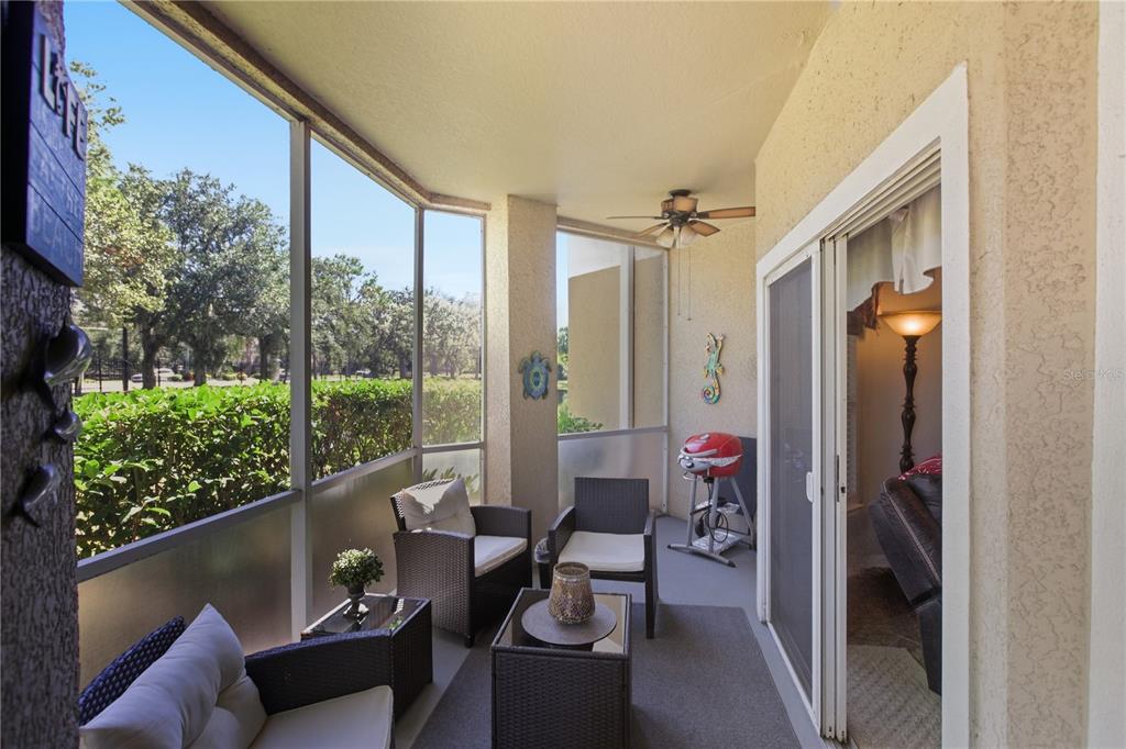 5122 Northridge Road, Unit 107 Sarasota, FL 34238 - Photo 24 of 36 a balcony with furniture and a potted plant