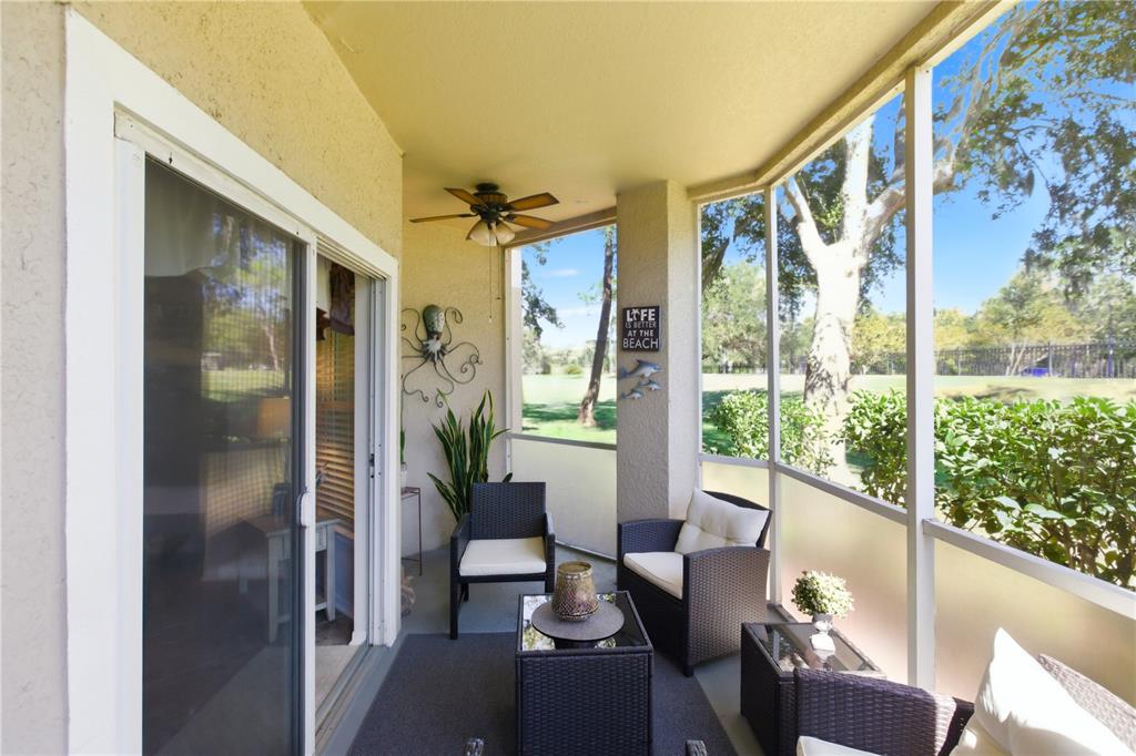 5122 Northridge Road, Unit 107 Sarasota, FL 34238 - Photo 25 of 36 a living room with furniture and windows
