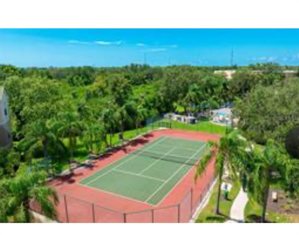 5122 Northridge Road, Unit 107 Sarasota, FL 34238 - Photo 31 of 36 a view of a tennis court