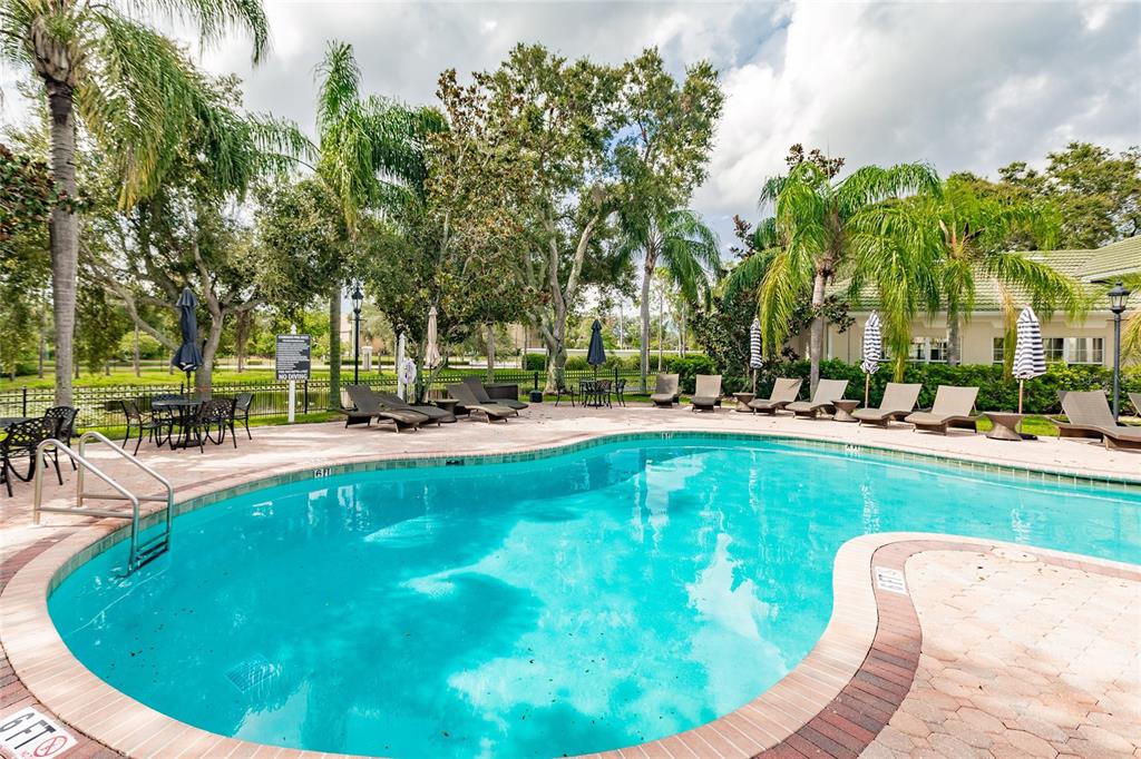 5122 Northridge Road, Unit 107 Sarasota, FL 34238 - Photo 33 of 36 a view of swimming pool and outdoor seating