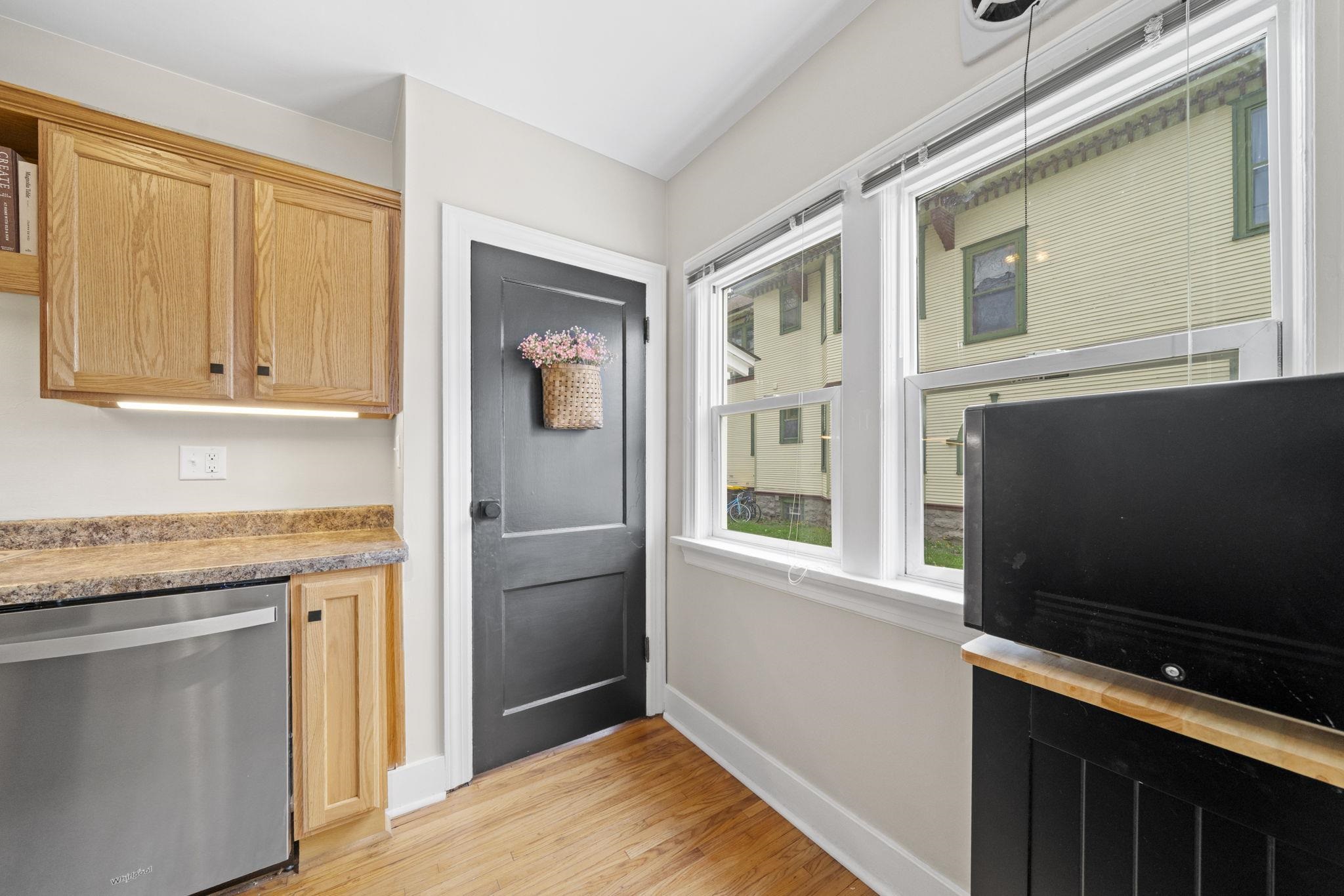 311 South 3rd Street Oregon, IL 61061 - Photo 12 of 24 a kitchen with stainless steel appliances granite countertop a refrigerator and a stove top oven