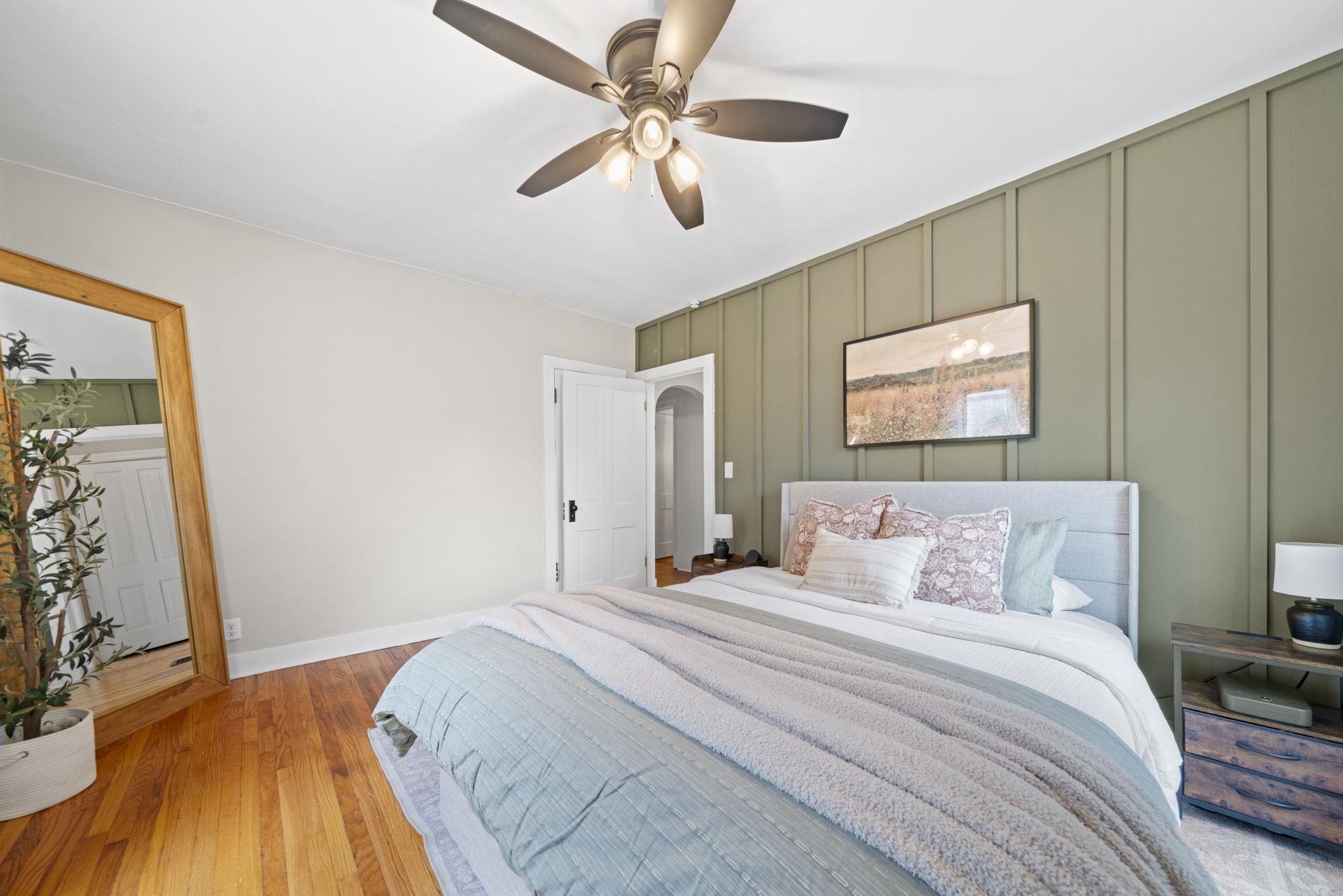 311 South 3rd Street Oregon, IL 61061 - Photo 15 of 24 a bedroom with a bed and a chandelier