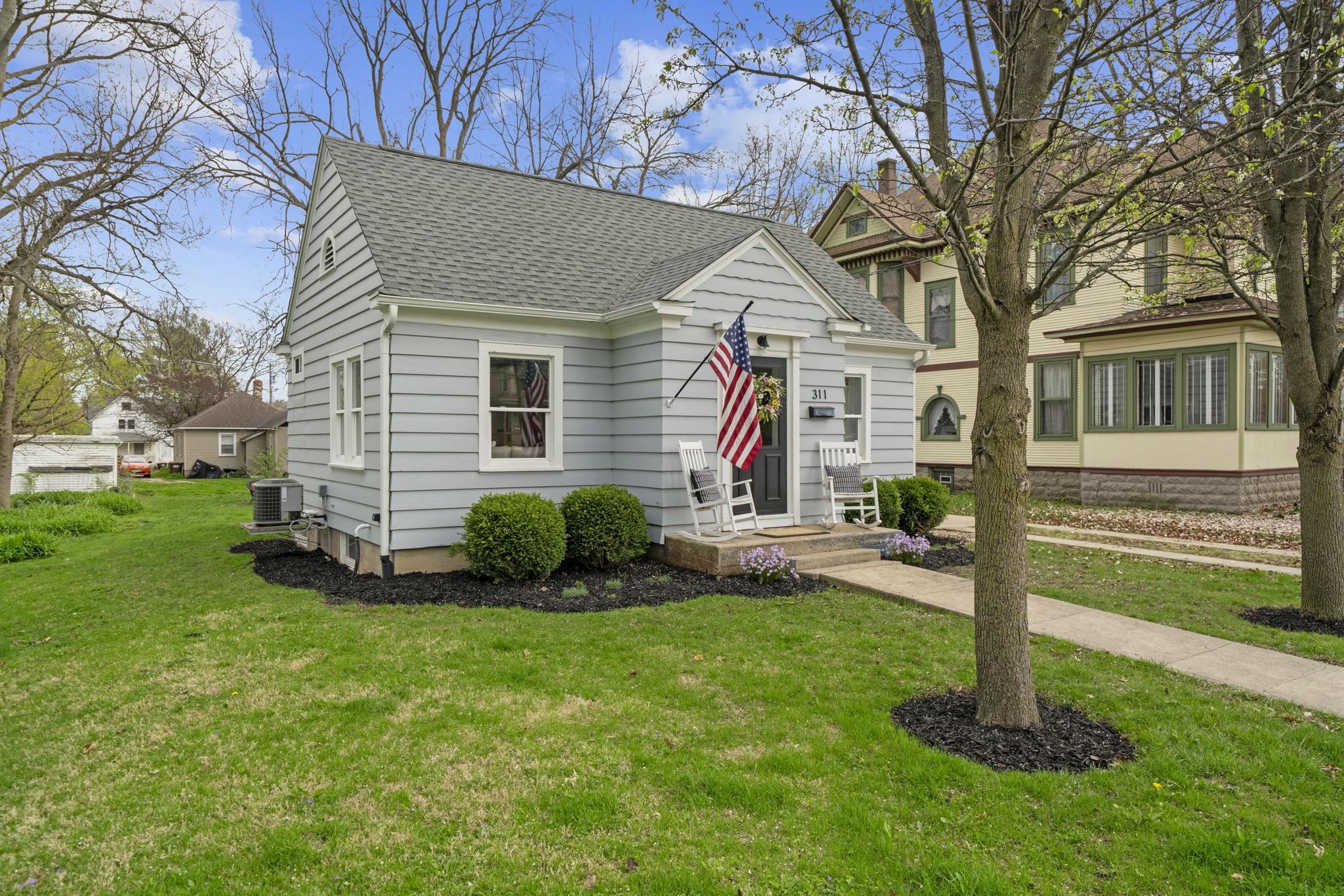 311 South 3rd Street Oregon, IL 61061 - Photo 2 of 24 a view of a house with backyard and porch