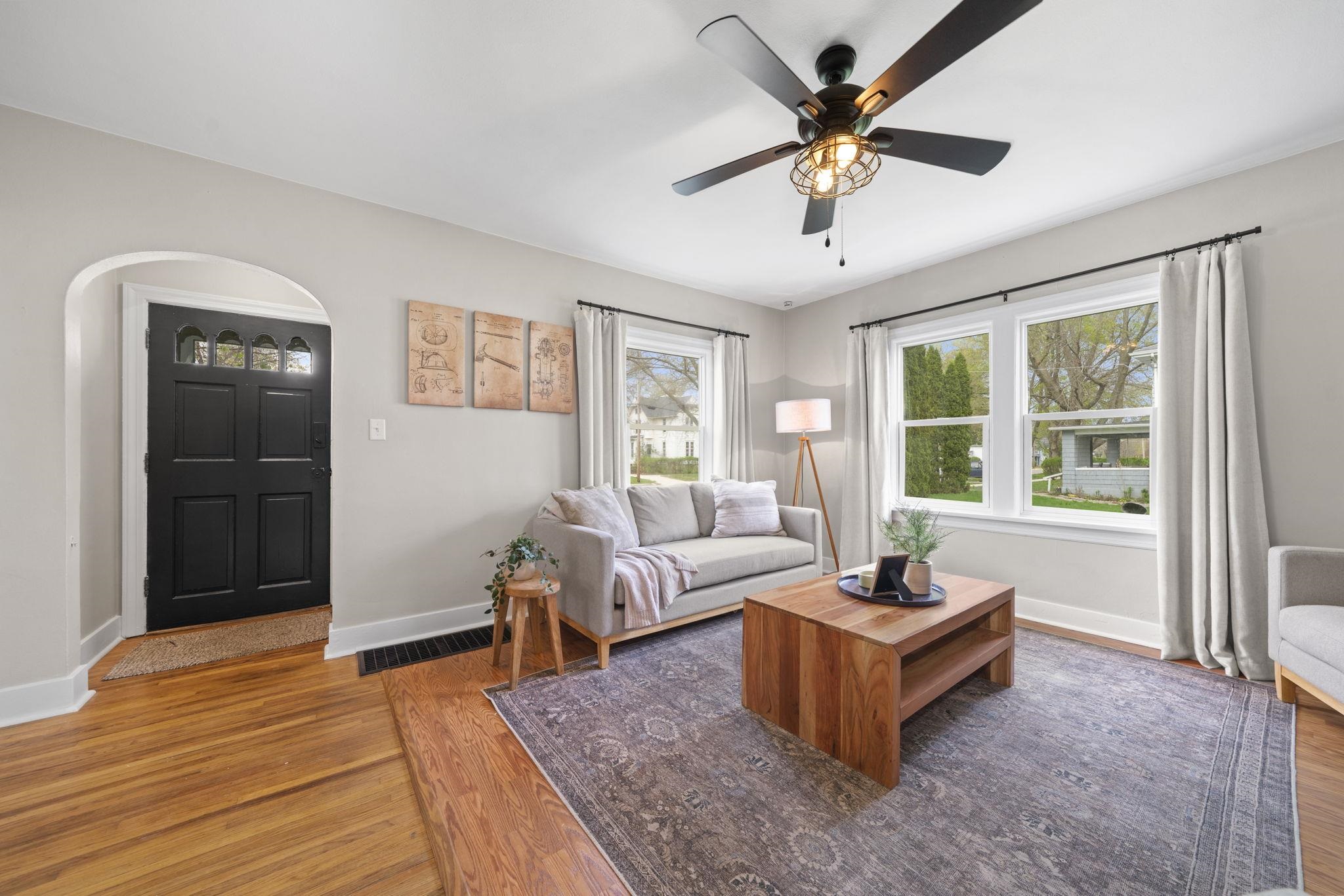 311 South 3rd Street Oregon, IL 61061 - Photo 3 of 24 a living room with furniture and a large window