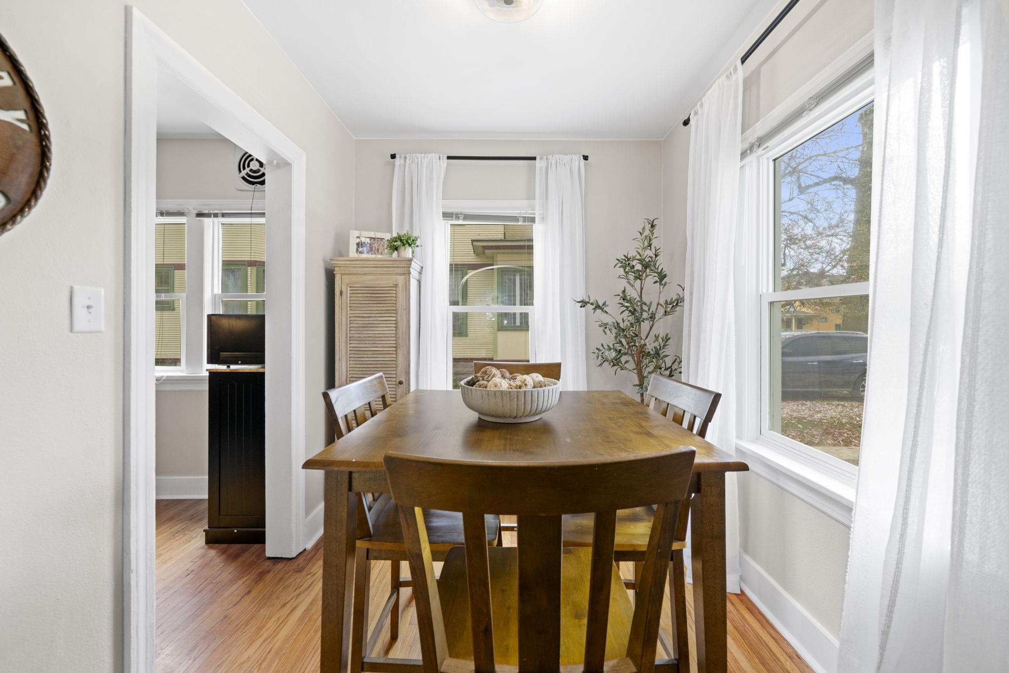 311 South 3rd Street Oregon, IL 61061 - Photo 7 of 24 a view of a dining room with furniture window and wooden floor