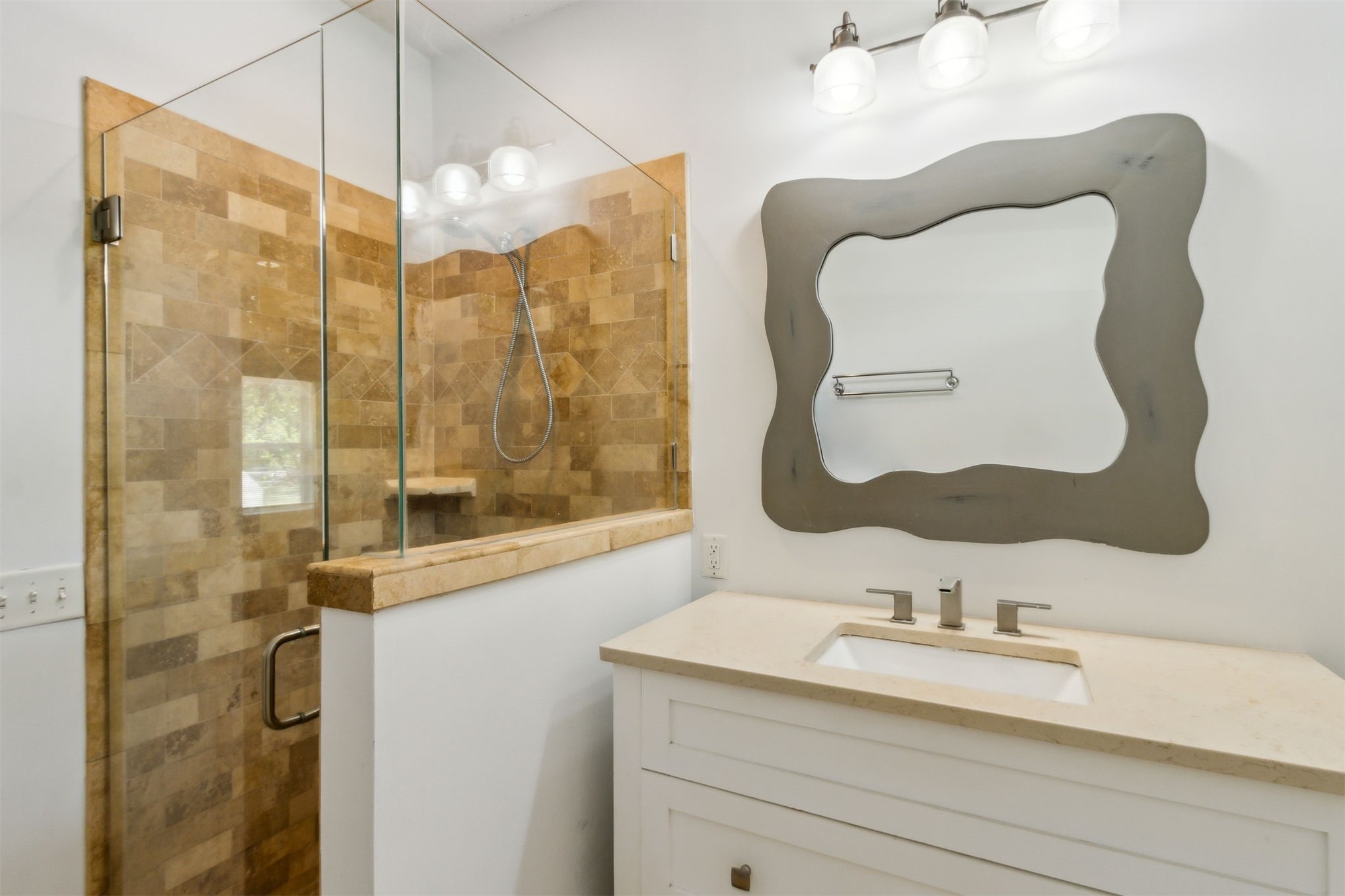2441 Amelia Road Fernandina Beach, FL 32034 - Photo 27 of 36 a bathroom with a sink and a mirror