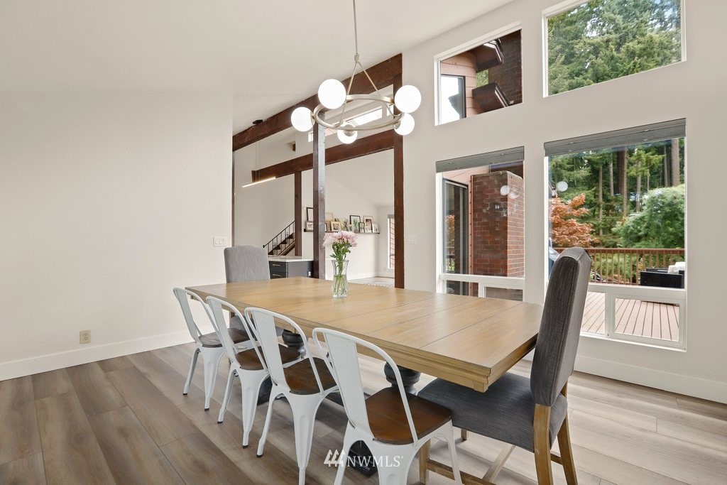 20830 28th Avenue Southeast Bothell, WA 98021 - Photo 15 of 40 a view of a dining room with furniture and wooden floor