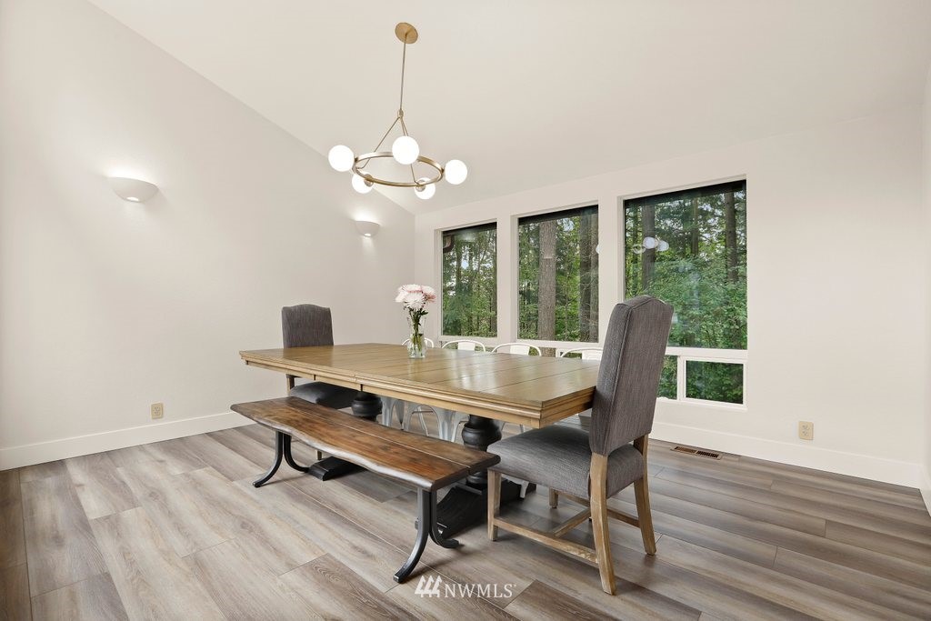 20830 28th Avenue Southeast Bothell, WA 98021 - Photo 16 of 40 a view of a workspace with furniture window and wooden floor