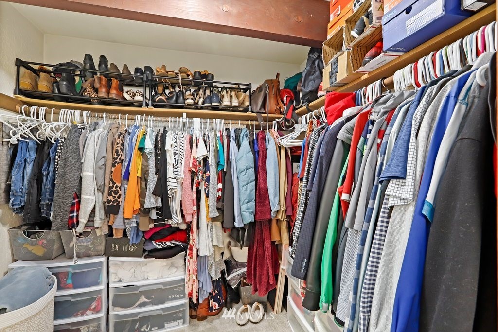 20830 28th Avenue Southeast Bothell, WA 98021 - Photo 21 of 40 a view of walk in closet with clothes and shoes
